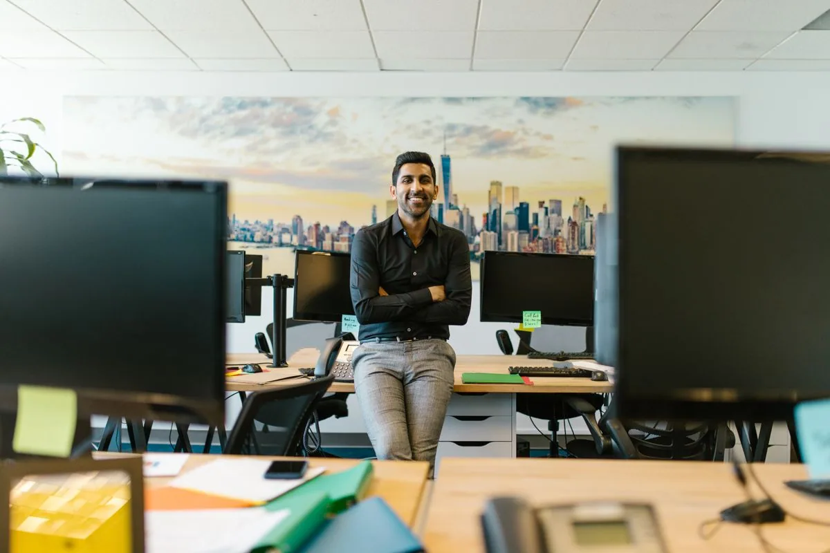 A founder working on a laptop — representing the AI tools that take a startup from idea to execution