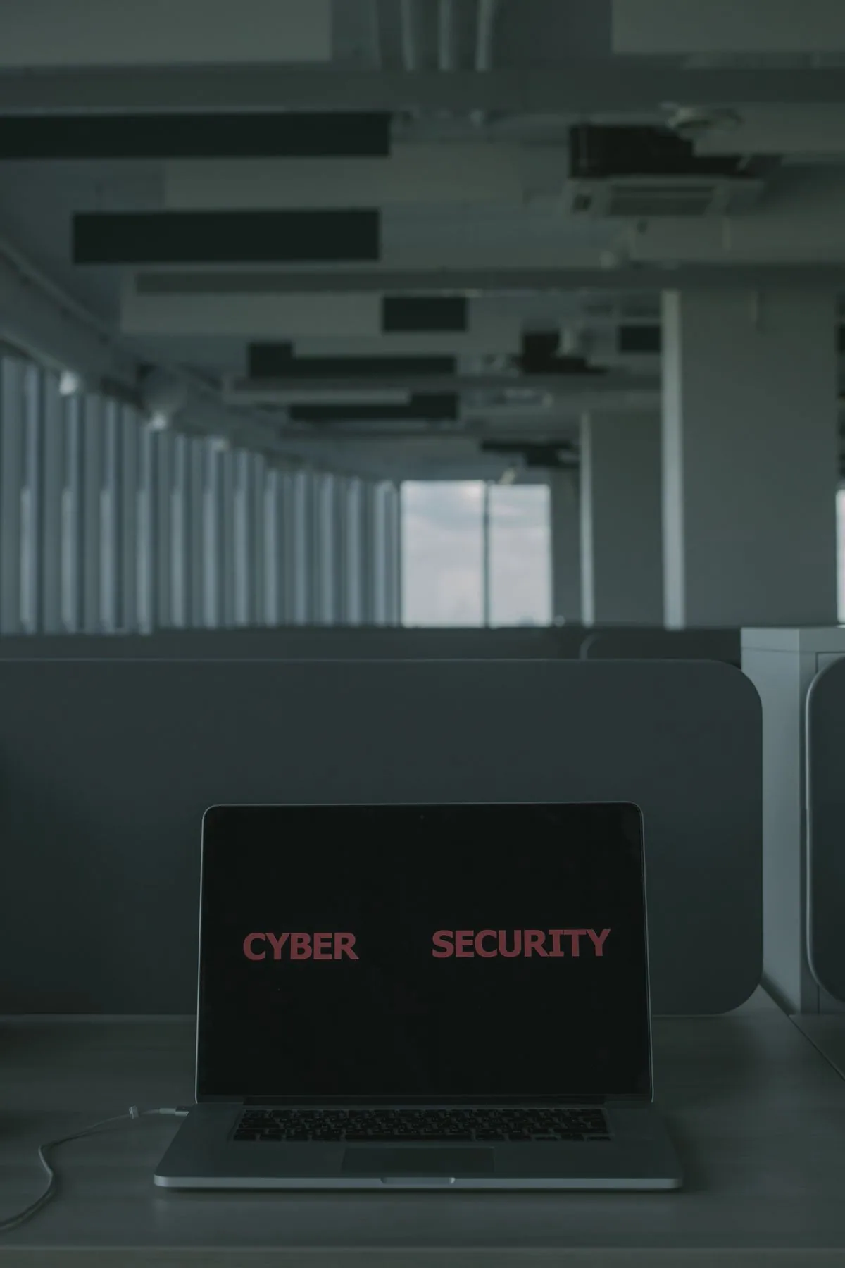 Laptop screen showing cybersecurity warning — representing a hacked WordPress site