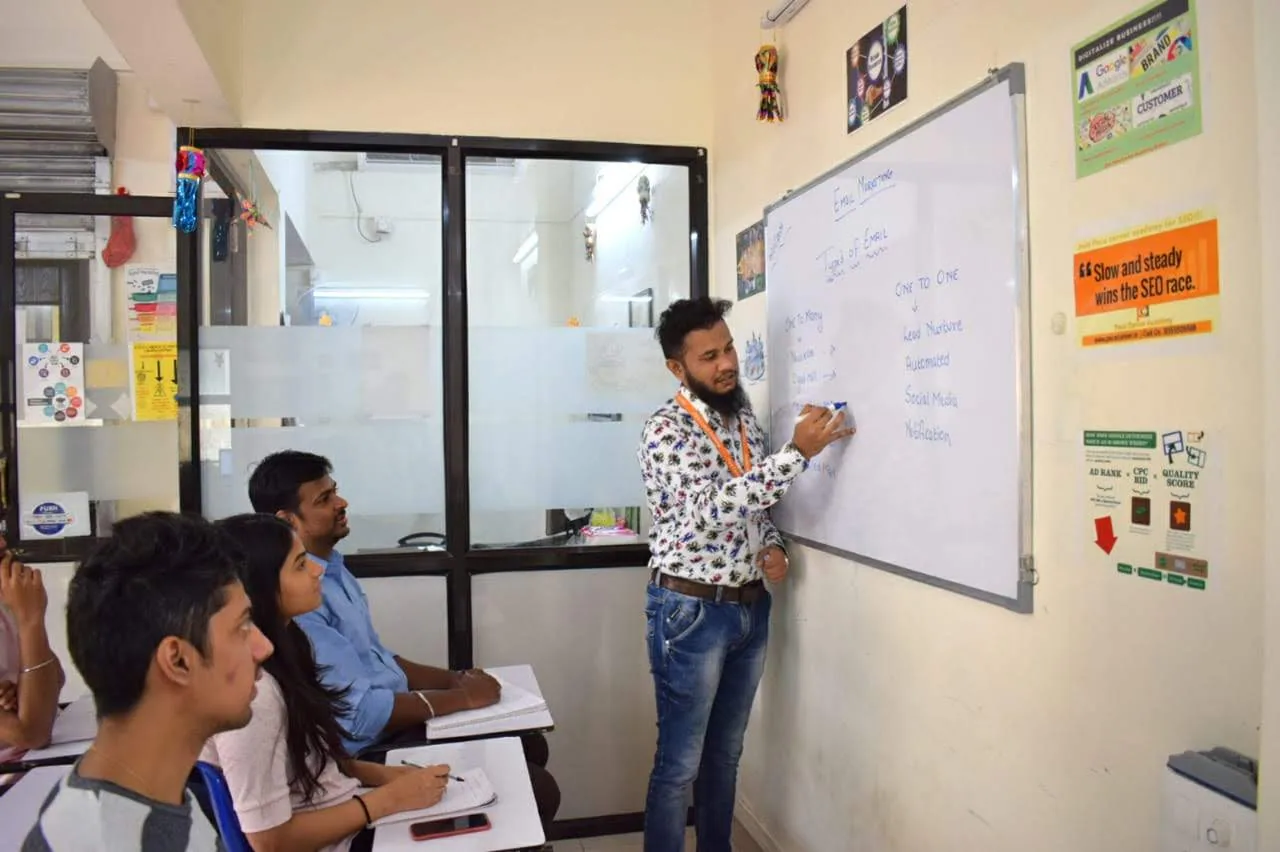 Shezad Ali Khan teaching at the whiteboard, Pace Career Academy
